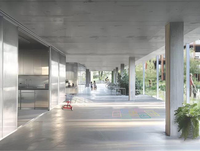 Der offene, durchl&auml;ssige Collective Living Room im Erdgeschoss verbindet den Nord- und S&uuml;dhof. Er schafft eine neue Form sozialer Infrastruktur, die Alltagsnutzung und gemeinschaftliche Aktivit&auml;ten kombiniert und f&ouml;rdert er Teilhabe, Identifikation und Austausch. Multifunktionale R&auml;ume, die sich flexibel zwischen Alltagsnutzung und gemeinschaftlicher Aktivit&auml;t bewegen, treffen hier auf quartiersbezogene Infrastrukturen wie Fahrraddepots, Postzonen oder gemeinschaftlich genutzte Nischen., Bild: E2A